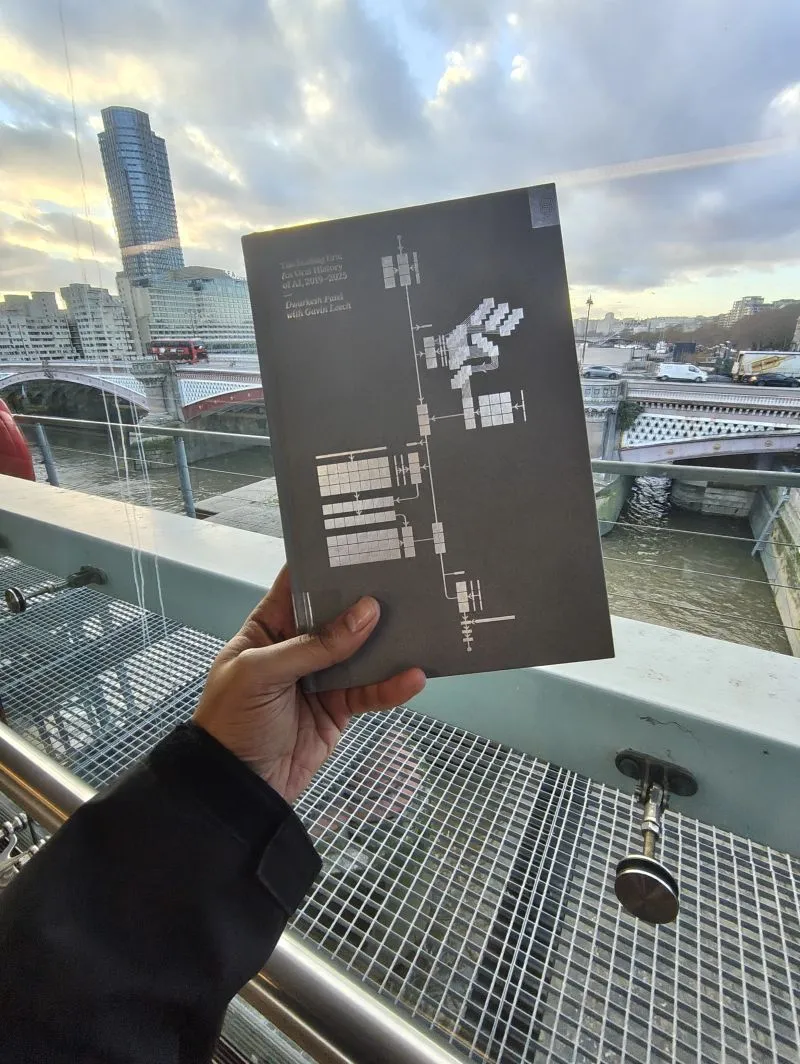 Reading The Scaling Era beside the River Thames in London